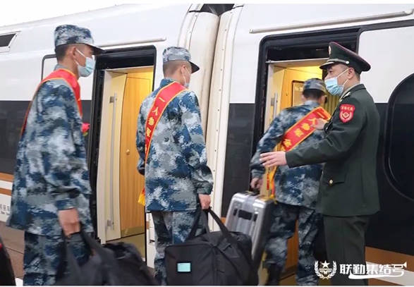 New conscripts boarding a high-speed train to travel to their units.