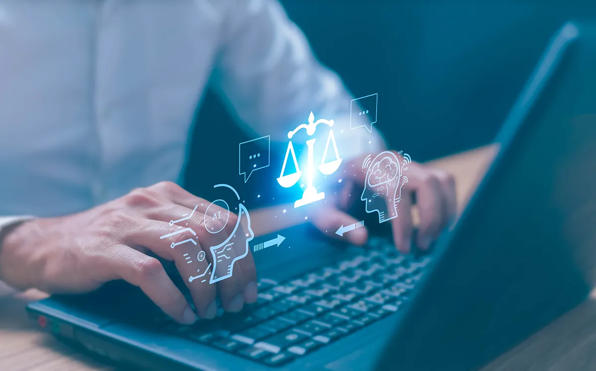 hands on laptop keyboard with image of balance