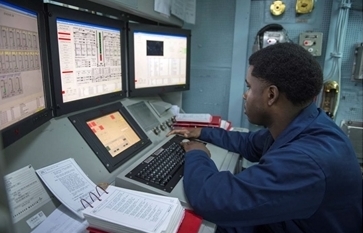  Gas Turbine Systems Technician (Mechanical) 2nd Class Quazavier Henderson monitors the engineering systems during a basic engineering casualty control exercise in the central control station of Arleigh Burke-class guided-missile destroyer USS Stout (DDG 55)